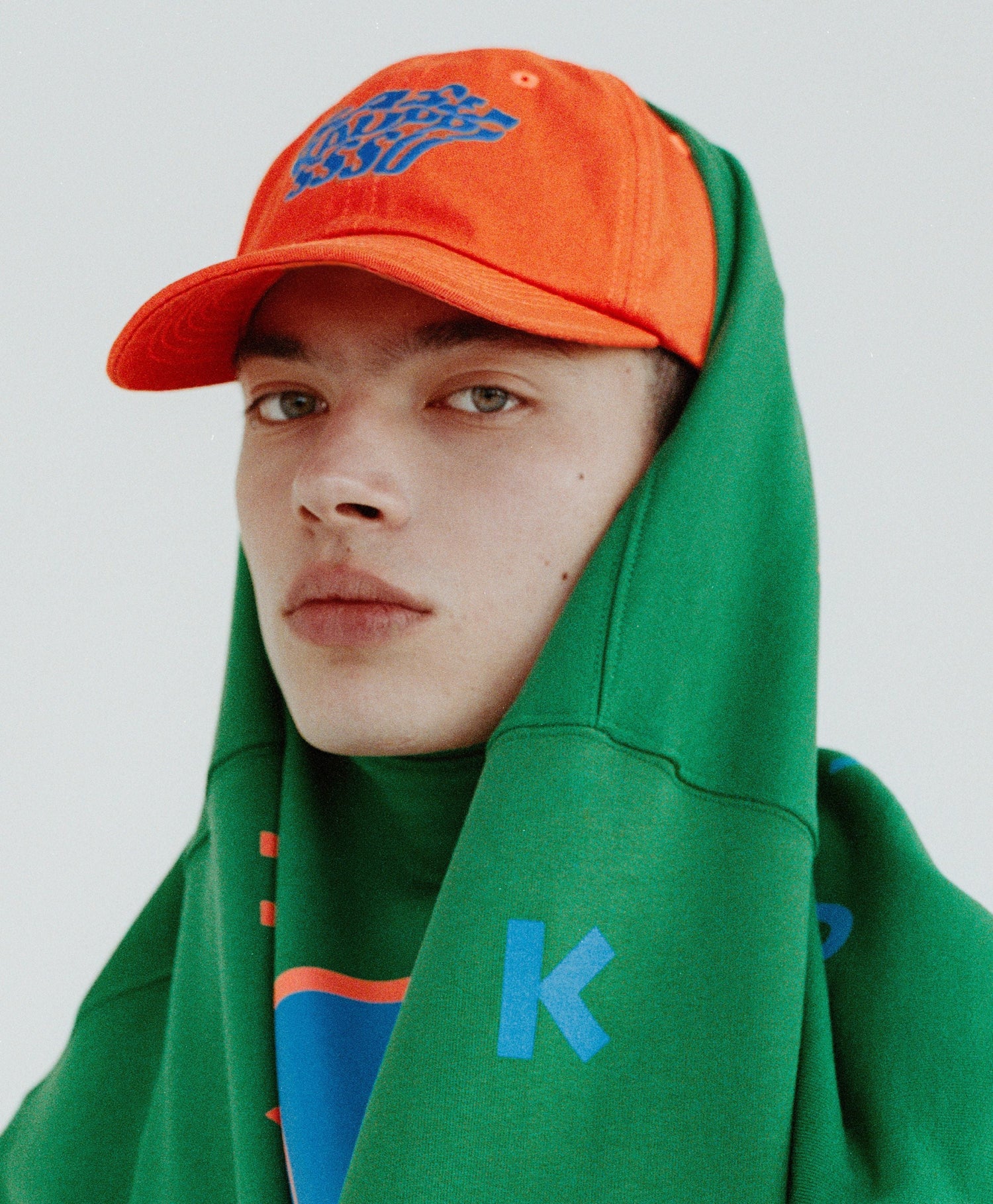 KARHU X SASU KAUPPI MORPHING KARHU CAP VERM. - ORANGE / IBI BLUE - Karhu Nederland